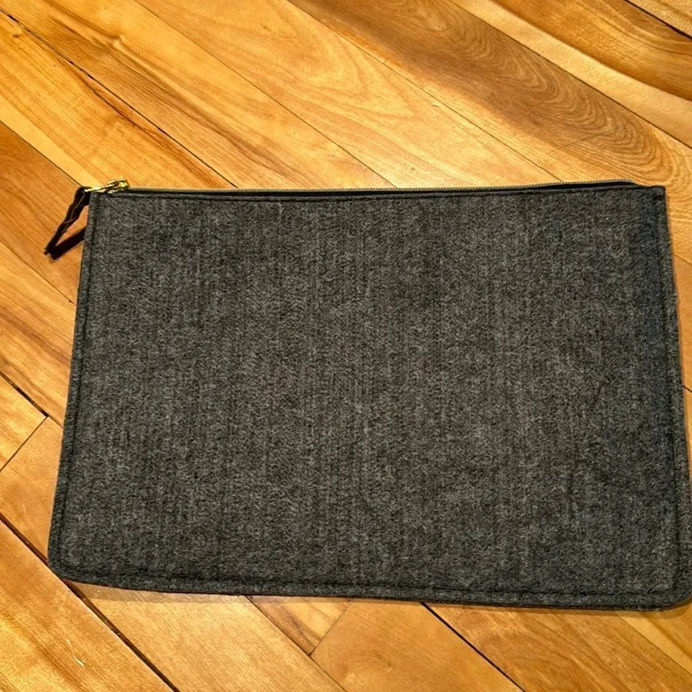 Heather gray felted zipper closure clutch. NWOT.